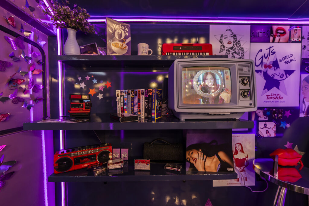 Olivia Rodrigo bus shelves by IHEARTCOMIX 2919 | Muse by Clios