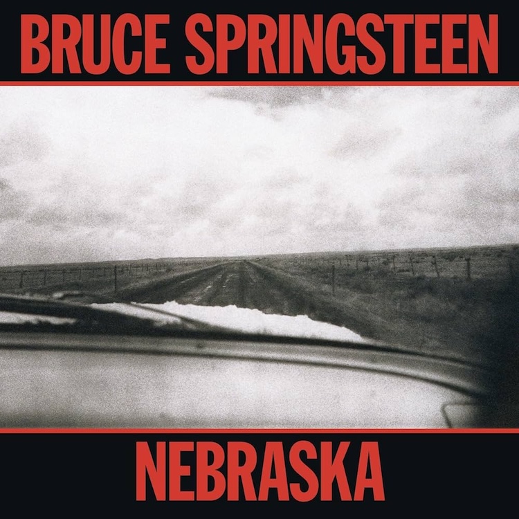 Bruce_Nebraska | Muse by Clios Bruce Springsteen Nebraska album cover: black-and-white photo of a desolate rural road viewed from a car, with bold red text at the top and bottom reading 'BRUCE SPRINGSTEEN' and 'NEBRASKA'.