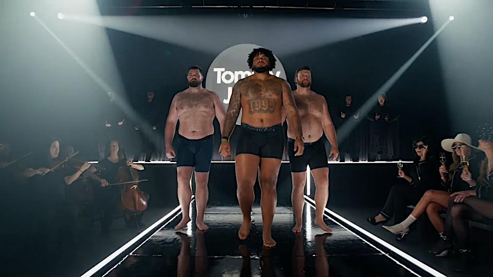 Brief Encounter: NFLers Prowl the Catwalk for Tommy John Image