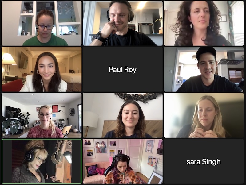 Screenshot | Muse by Clios Video conference grid showing twelve participants in their home spaces; center tile labeled'Paul Roy' and bottom-right tile labeled 'sara Singh' indicate names. Participants appear engaged, some wearing headphones, in casual surroundings.
