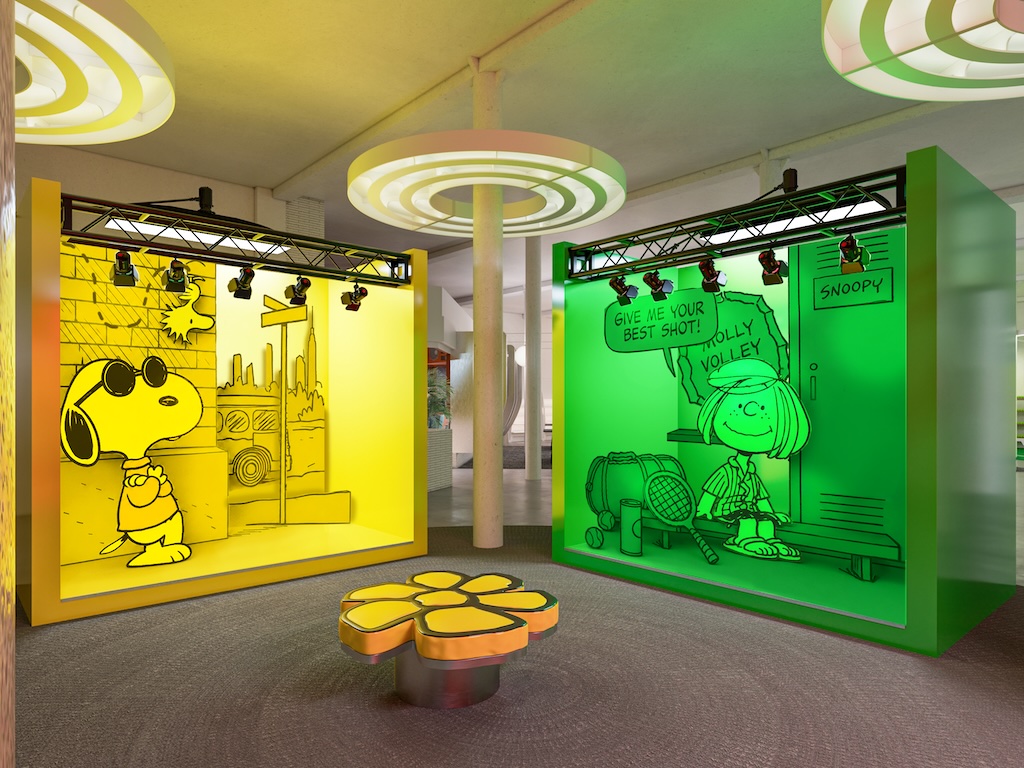 INSTA WITH YELLOW AND GREEN INTERIORS | Muse by Clios Peanuts-themed exhibit with yellow Snoopy artwork on the left and a green panel featuring a girl and a speech bubble in the center of a bright gallery room.